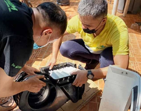 PrimeChem technicians servicing an AC blower fan and filter assembly