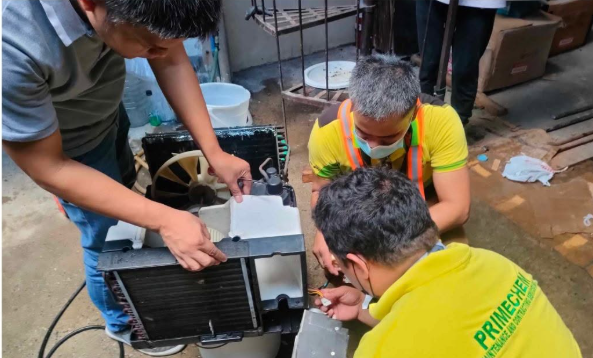 PrimeChem technicians deep cleaning an air-conditioning unit