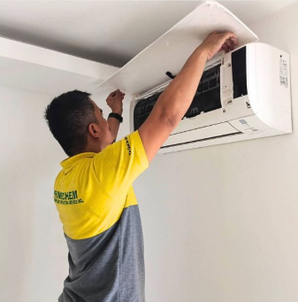 PrimeChem technician servicing a split-type air conditioner