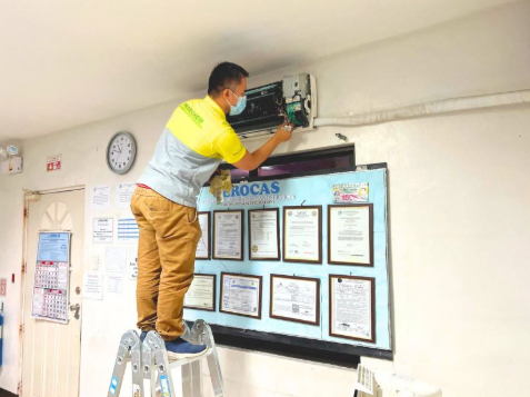 PrimeChem technician servicing HVAC equipment on-site